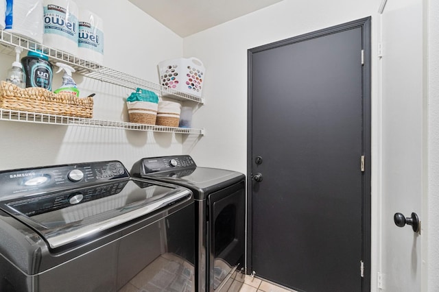 5532 W Indianapolis Ave, Fresno, CA 93722 - clothes washing area with washer and clothes dryer and light tile patterned flooring