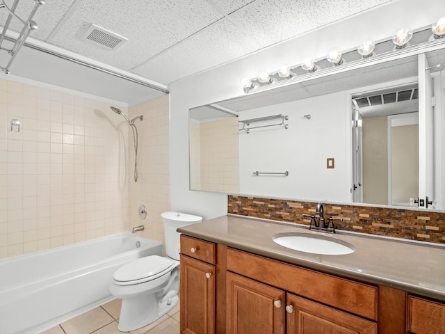 1550 W Ashlan Ave Unit 241, Fresno, CA 93705 - bathroom featuring tile patterned flooring, tasteful backsplash, toilet, shower / bath combination, and vanity