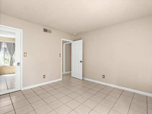 1550 W Ashlan Ave Unit 241, Fresno, CA 93705 - unfurnished room featuring light tile patterned floors and baseboards