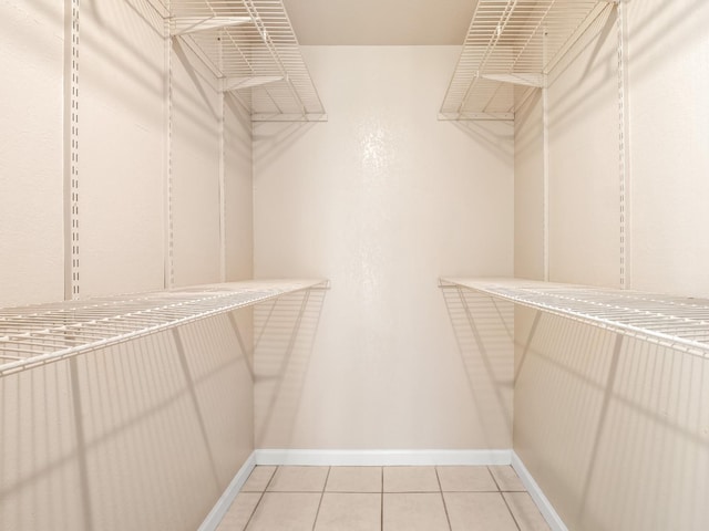 1550 W Ashlan Ave Unit 241, Fresno, CA 93705 - walk in closet featuring light tile patterned floors