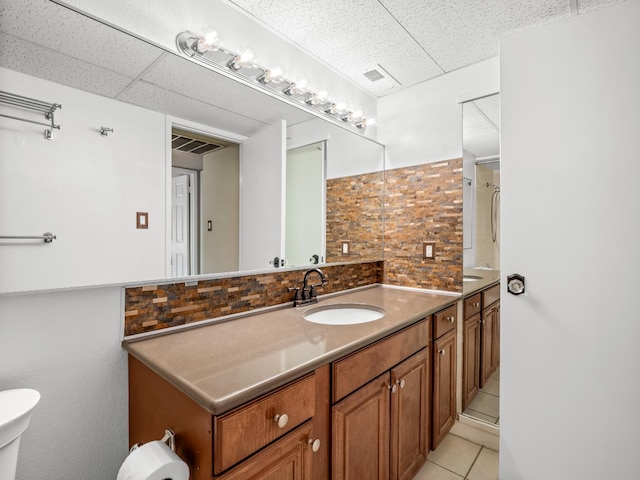 1550 W Ashlan Ave Unit 241, Fresno, CA 93705 - bathroom with backsplash, tile patterned flooring, vanity, a shower, and a paneled ceiling