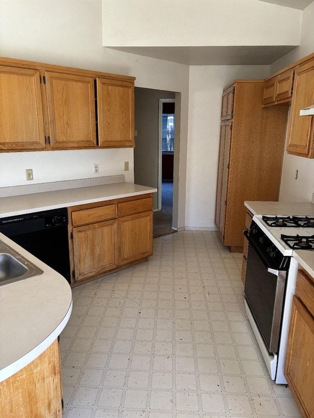 413 Buckeye Springs St, Coalinga, CA 93210 - kitchen with gas stove, light flooring, black dishwasher, and light countertops