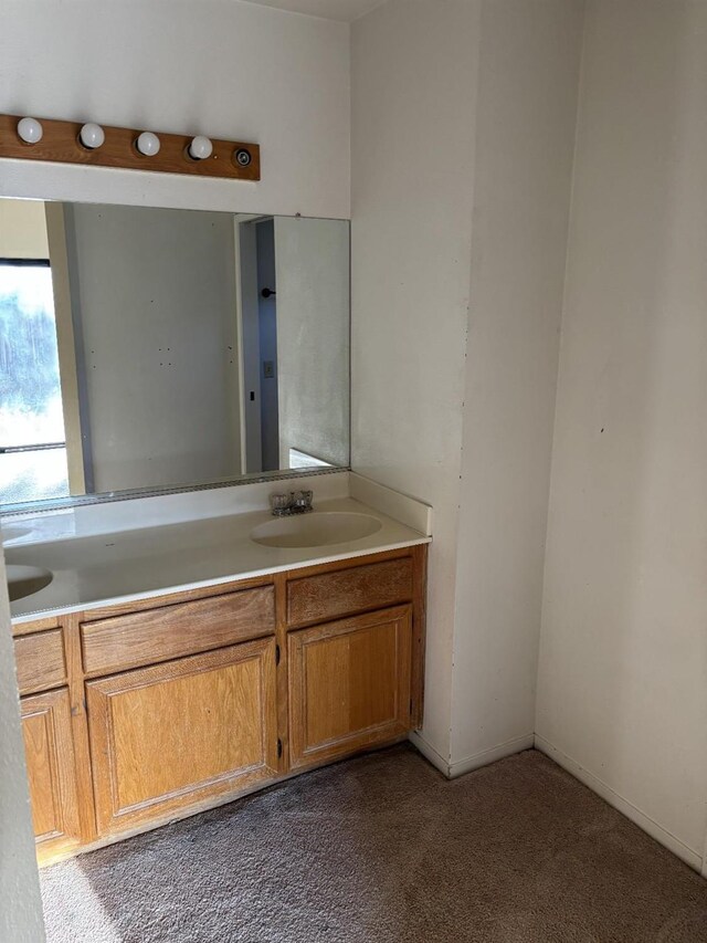 413 Buckeye Springs St, Coalinga, CA 93210 - bathroom featuring double vanity and carpet floors