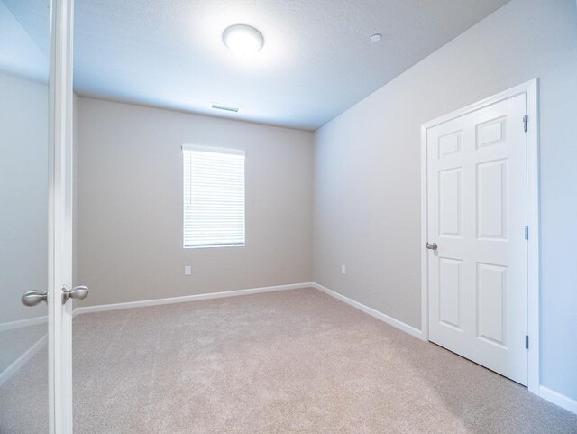 873 Beaver Pond Loop, Madera, CA 93636 - empty room featuring carpet and baseboards