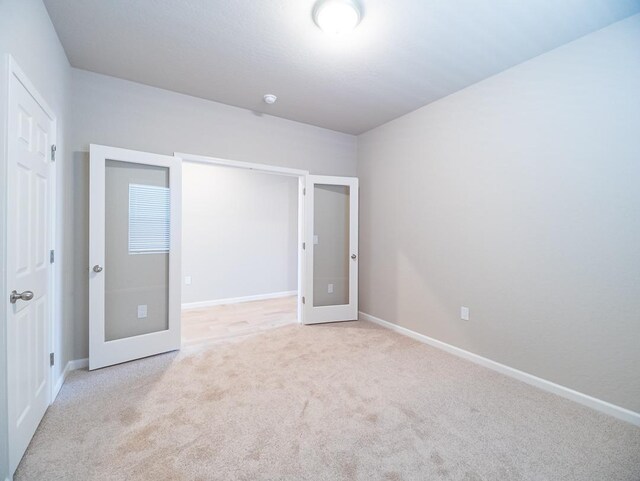 873 Beaver Pond Loop, Madera, CA 93636 - unfurnished bedroom with carpet, baseboards, and french doors