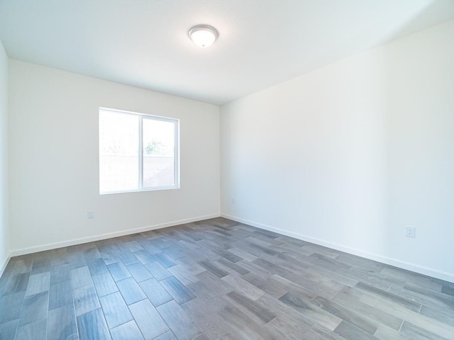 878 Beaver Pond Loop, Madera, CA 93636 - empty room with wood finished floors and baseboards