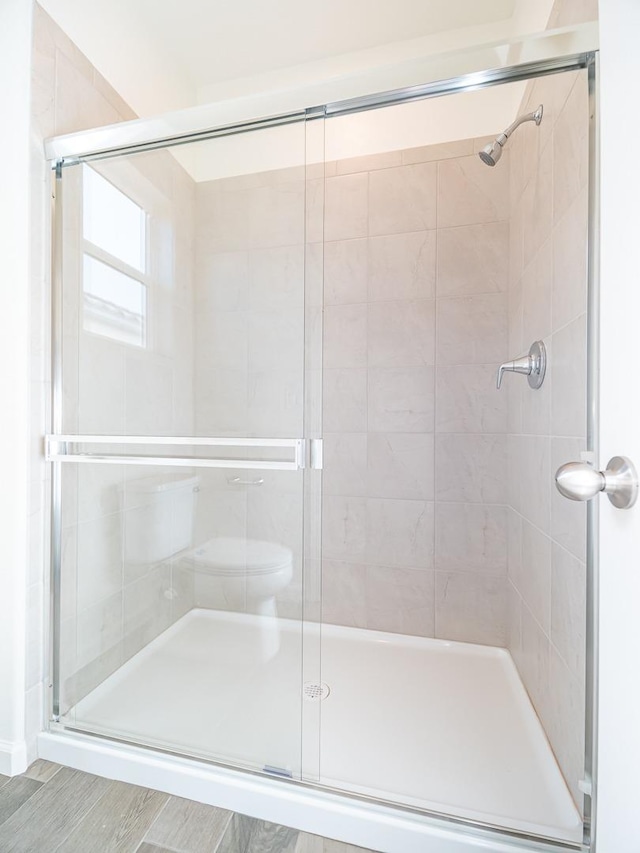 878 Beaver Pond Loop, Madera, CA 93636 - full bathroom with a stall shower and toilet