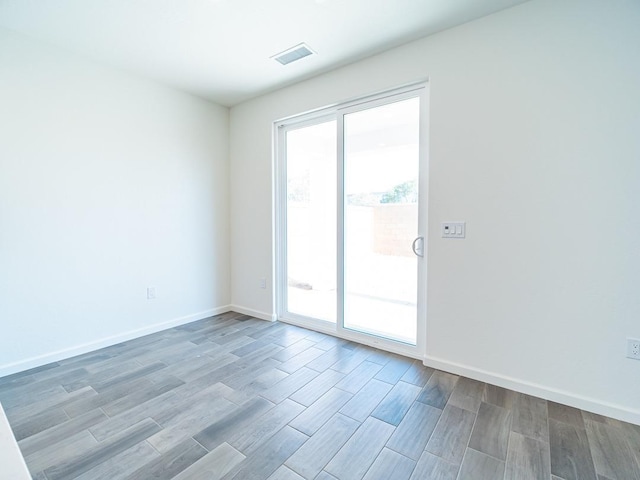 878 Beaver Pond Loop, Madera, CA 93636 - spare room with baseboards and wood finished floors