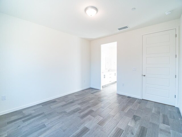 878 Beaver Pond Loop, Madera, CA 93636 - unfurnished room featuring wood finished floors and baseboards