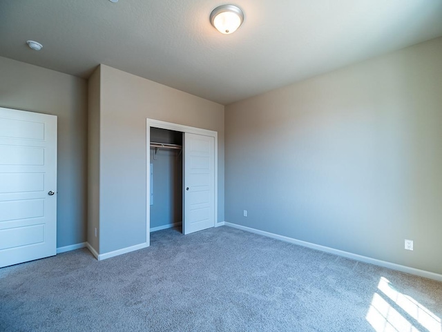 917 Beaver Pond Loop, Madera, CA 93636 - unfurnished bedroom with carpet floors, a closet, and baseboards