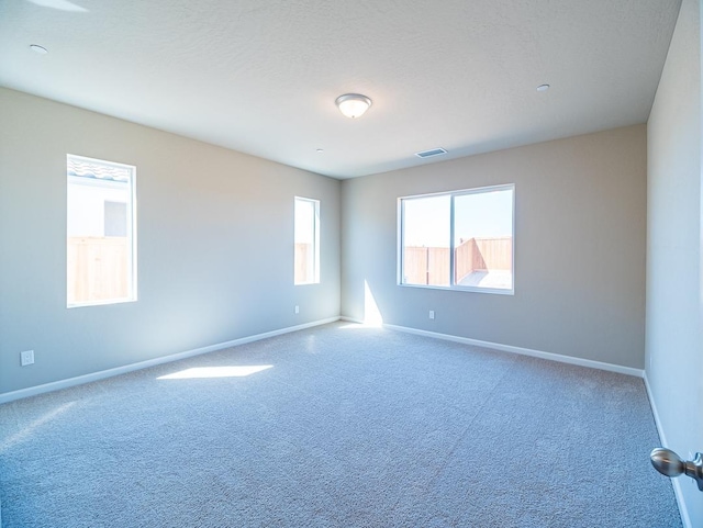 917 Beaver Pond Loop, Madera, CA 93636 - spare room featuring baseboards and carpet floors