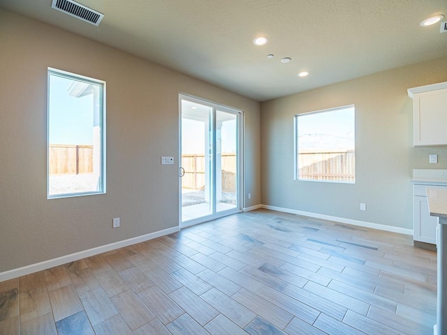 917 Beaver Pond Loop, Madera, CA 93636 - empty room with light wood finished floors, baseboards, and recessed lighting