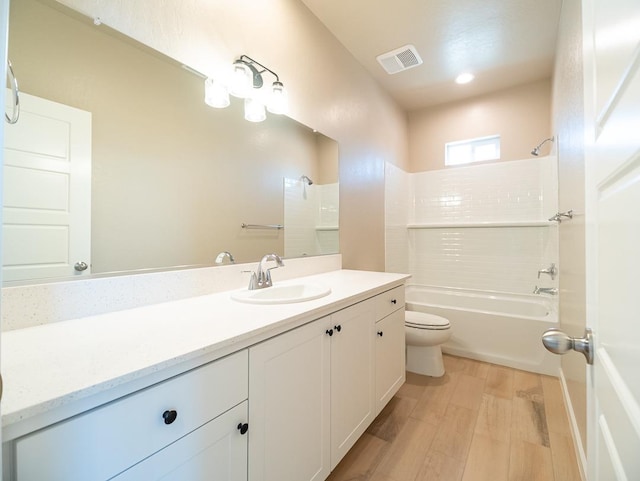 917 Beaver Pond Loop, Madera, CA 93636 - full bath featuring toilet, washtub / shower combination, wood finished floors, and vanity