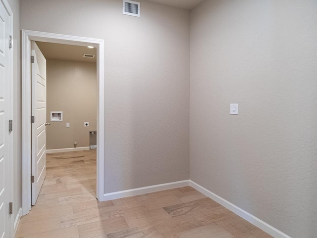 917 Beaver Pond Loop, Madera, CA 93636 - corridor with light wood finished floors and baseboards