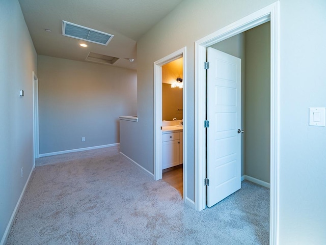 917 Beaver Pond Loop, Madera, CA 93636 - corridor featuring attic access, carpet, and baseboards