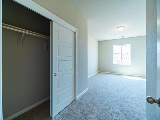917 Beaver Pond Loop, Madera, CA 93636 - unfurnished bedroom featuring carpet, baseboards, and a closet
