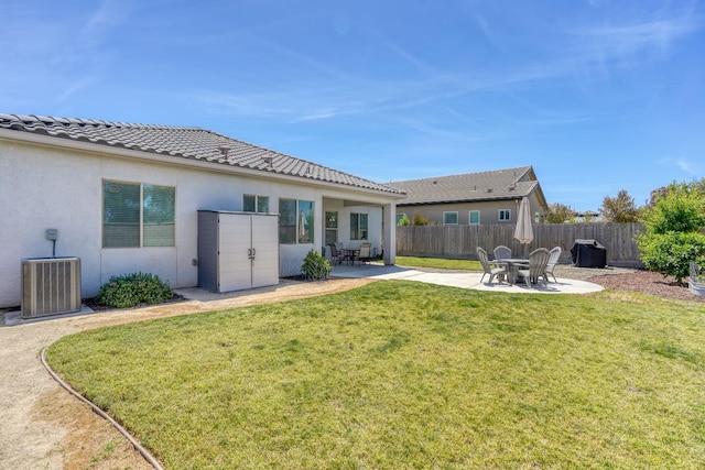 716 Mesa Dr S, Madera, CA 93636 - back of house featuring a patio area, central AC unit, stucco siding, and a tiled roof