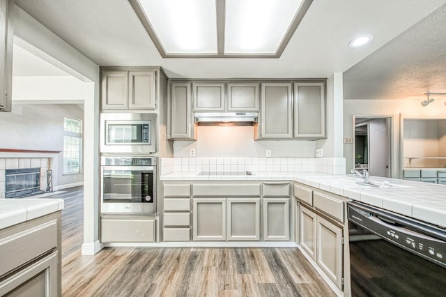 580 W Alluvial Ave, Clovis, CA 93611 - kitchen featuring black appliances, gray cabinetry, light wood-style flooring, and recessed lighting