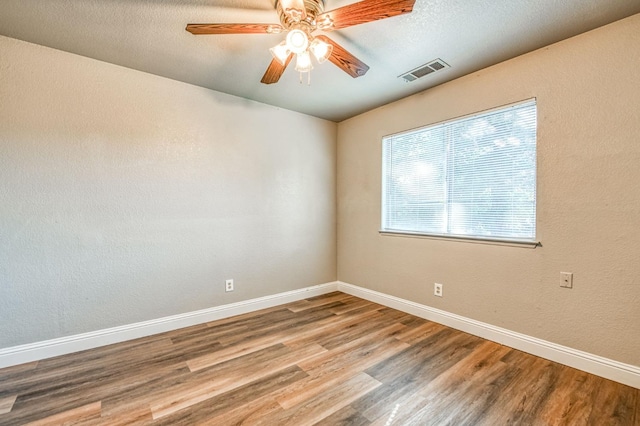 580 W Alluvial Ave, Clovis, CA 93611 - unfurnished room with wood finished floors, baseboards, and ceiling fan