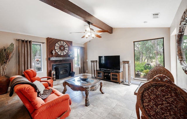 living area with a ceiling fan and baseboards