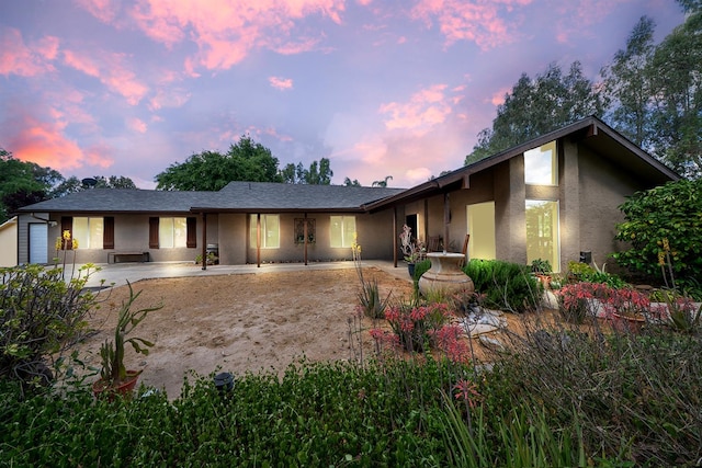 view of front of house featuring stucco siding