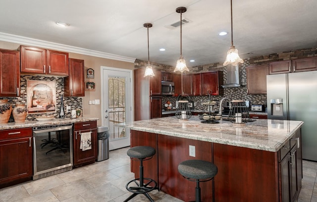 kitchen featuring wine cooler, appliances with stainless steel finishes, wall chimney range hood, tasteful backsplash, and light stone countertops