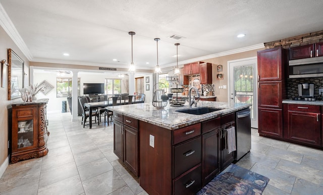 kitchen with a sink, dark brown cabinets, stainless steel dishwasher, light stone counters, and plenty of natural light