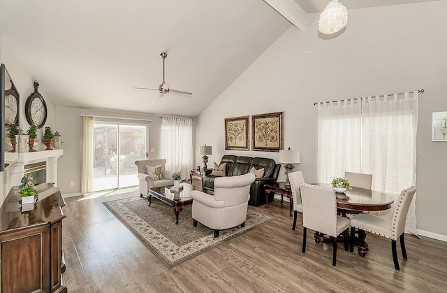 1073 E Pennsylvania Ave, Fresno, CA 93720 - living room with a ceiling fan, beamed ceiling, high vaulted ceiling, wood finished floors, and baseboards