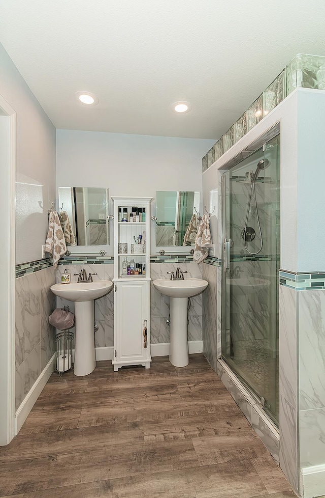 1073 E Pennsylvania Ave, Fresno, CA 93720 - full bath featuring a stall shower, wood finished floors, a sink, and recessed lighting