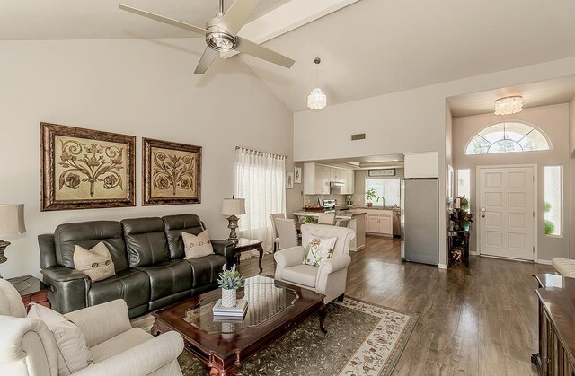 1073 E Pennsylvania Ave, Fresno, CA 93720 - living area with high vaulted ceiling, dark wood-type flooring, and a ceiling fan