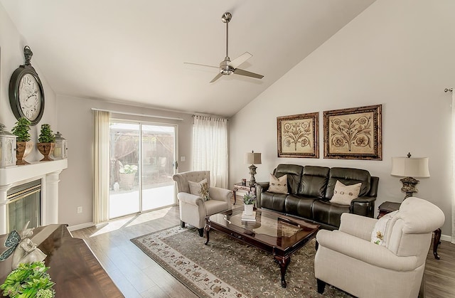 1073 E Pennsylvania Ave, Fresno, CA 93720 - living room with a ceiling fan, wood finished floors, baseboards, and high vaulted ceiling