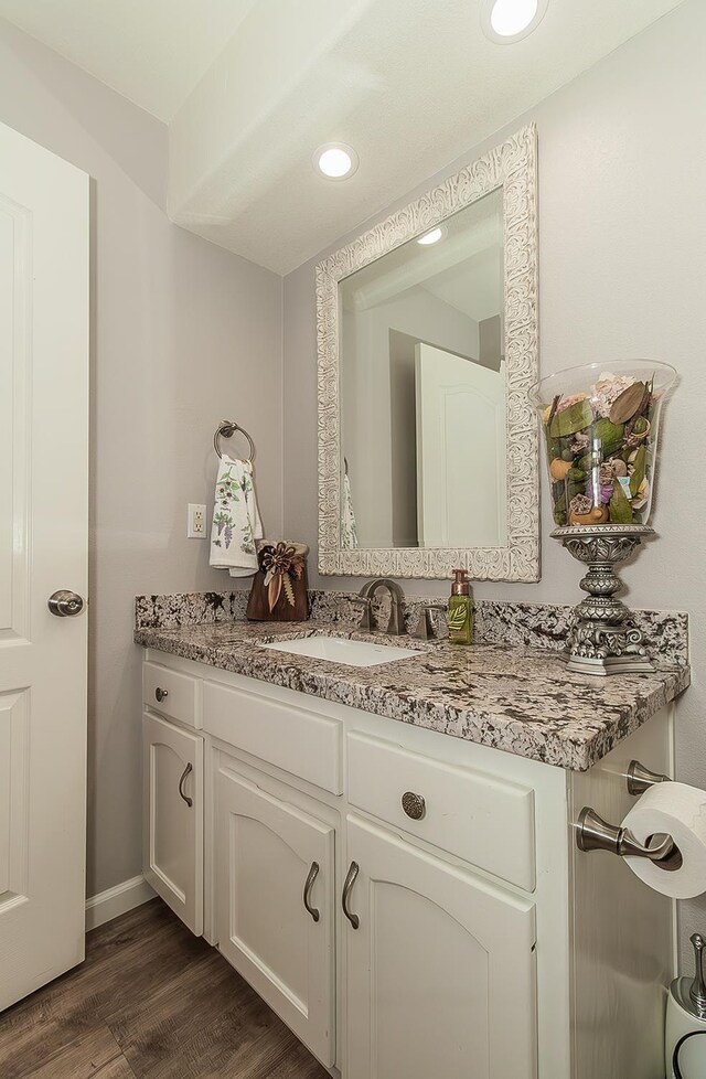 1073 E Pennsylvania Ave, Fresno, CA 93720 - bathroom with vanity, wood finished floors, recessed lighting, and baseboards