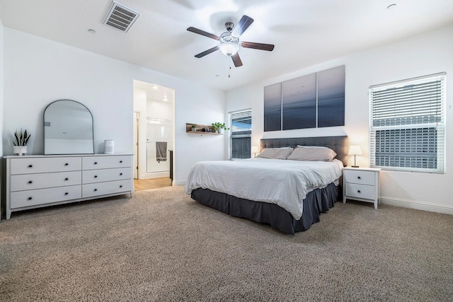 6772 E Ramona Way, Fresno, CA 93727 - bedroom with carpet floors, baseboards, multiple windows, and ensuite bathroom