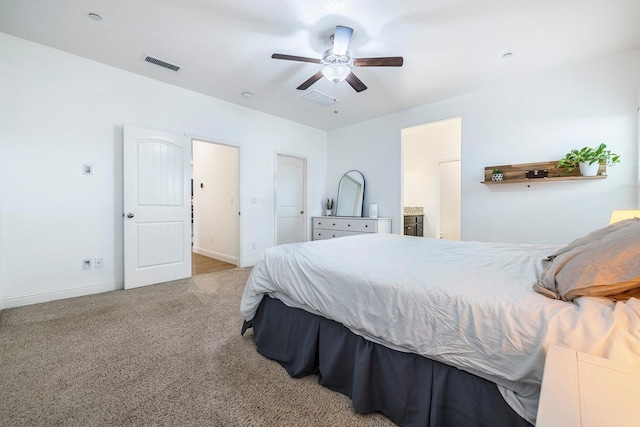 6772 E Ramona Way, Fresno, CA 93727 - bedroom featuring baseboards, carpet floors, ensuite bath, and a ceiling fan