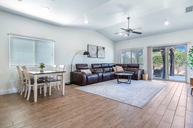 6772 E Ramona Way, Fresno, CA 93727 - living room featuring wood finished floors, a ceiling fan, vaulted ceiling, and baseboards