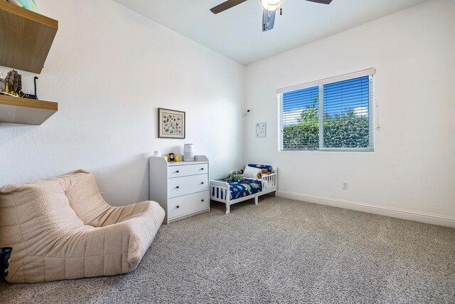 6772 E Ramona Way, Fresno, CA 93727 - bedroom with light colored carpet, baseboards, and a ceiling fan