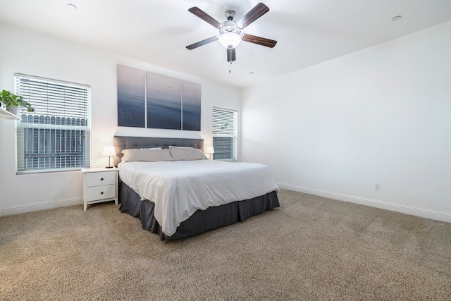 6772 E Ramona Way, Fresno, CA 93727 - bedroom featuring light colored carpet, baseboards, and a ceiling fan