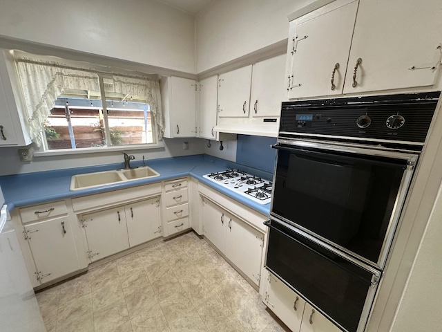 1482 W Thurman, Porterville, CA 93257 - kitchen with oven, a sink, white gas stovetop, under cabinet range hood, and a warming drawer
