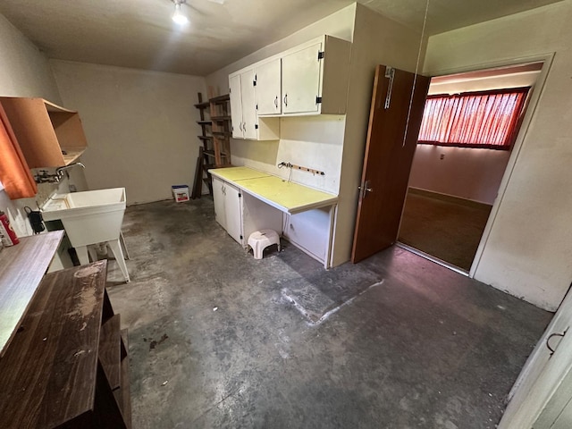 1482 W Thurman, Porterville, CA 93257 - kitchen with concrete floors, white cabinets, and light countertops