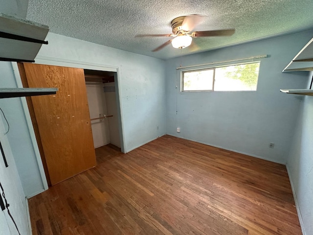 1482 W Thurman, Porterville, CA 93257 - unfurnished bedroom with a textured ceiling, wood finished floors, a closet, and ceiling fan
