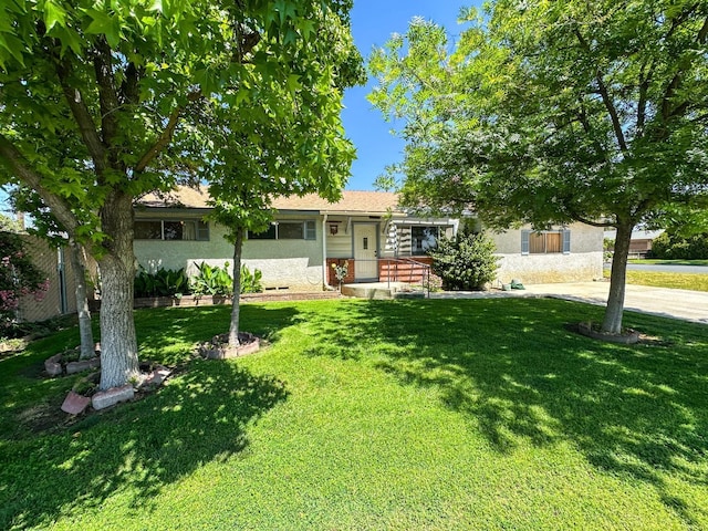 1482 W Thurman, Porterville, CA 93257 - view of front of house with a front yard and stucco siding