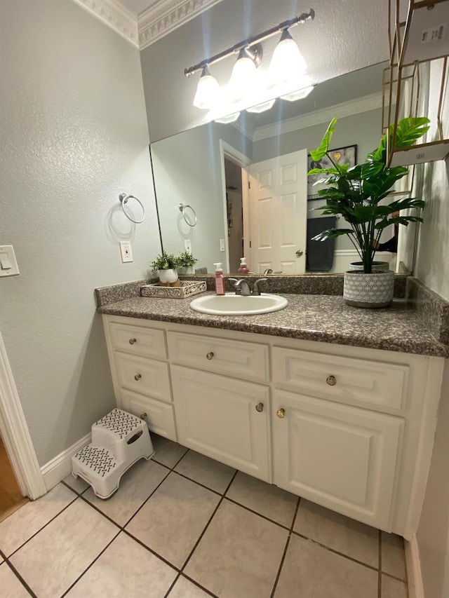 1035 Hoover Way, Hanford, CA 93230 - bathroom featuring vanity, ornamental molding, tile patterned flooring, baseboards, and a chandelier
