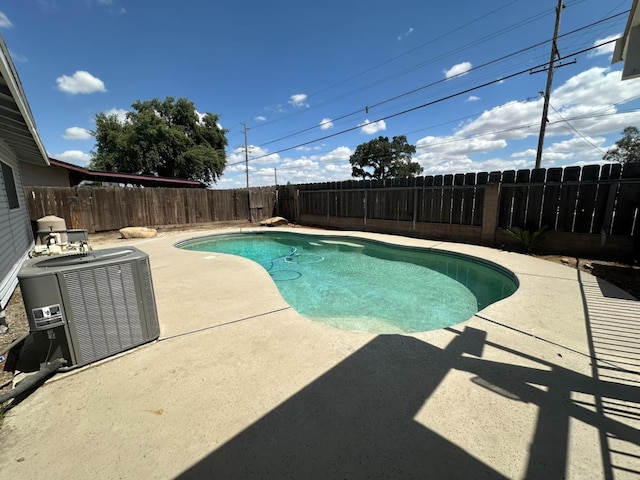 1035 Hoover Way, Hanford, CA 93230 - view of pool with a patio, central AC, and a fenced backyard