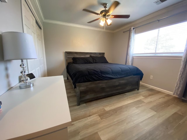 1035 Hoover Way, Hanford, CA 93230 - bedroom with ornamental molding, light wood-style floors, a closet, baseboards, and a ceiling fan