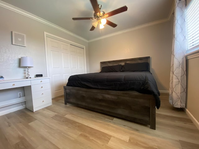 1035 Hoover Way, Hanford, CA 93230 - bedroom with light wood-style floors, a closet, crown molding, baseboards, and ceiling fan