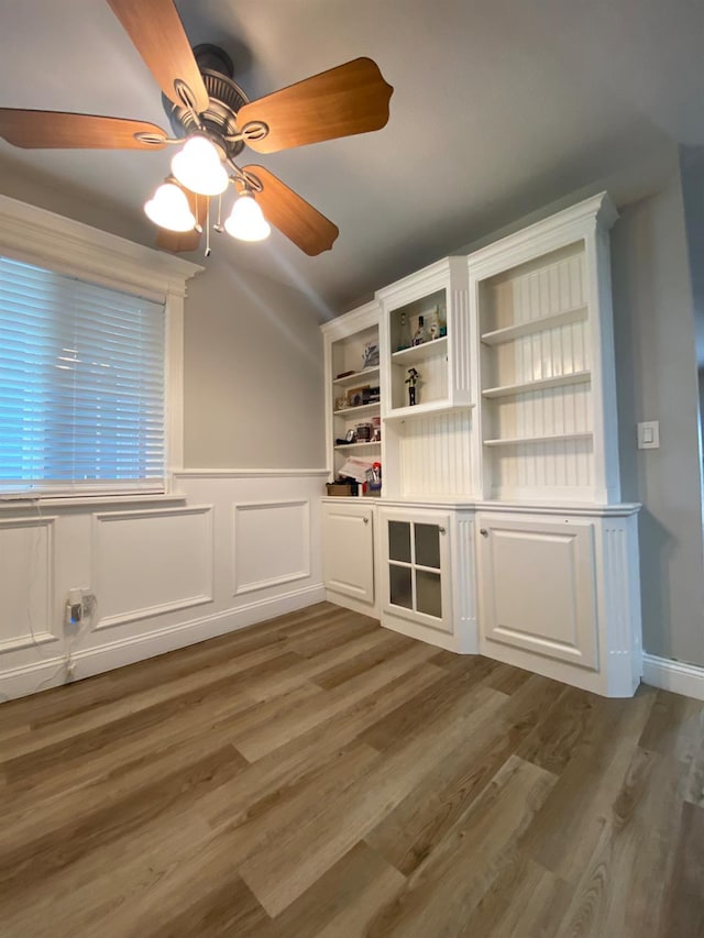 1035 Hoover Way, Hanford, CA 93230 - spare room featuring wood finished floors, wainscoting, and ceiling fan