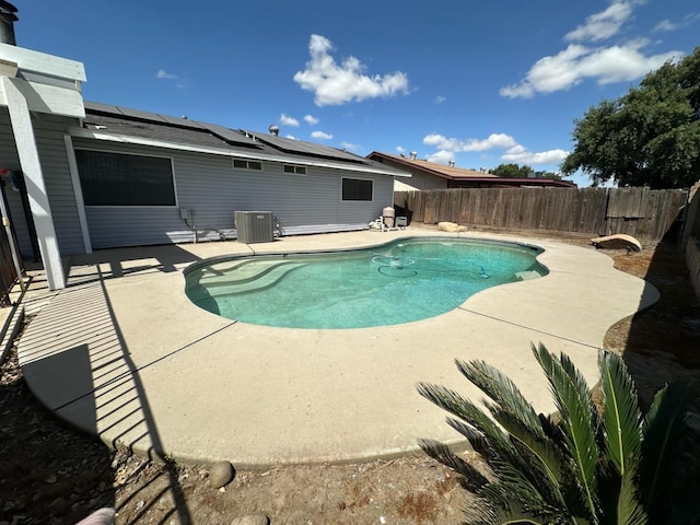 1035 Hoover Way, Hanford, CA 93230 - view of pool featuring a patio area, a fenced backyard, and cooling unit