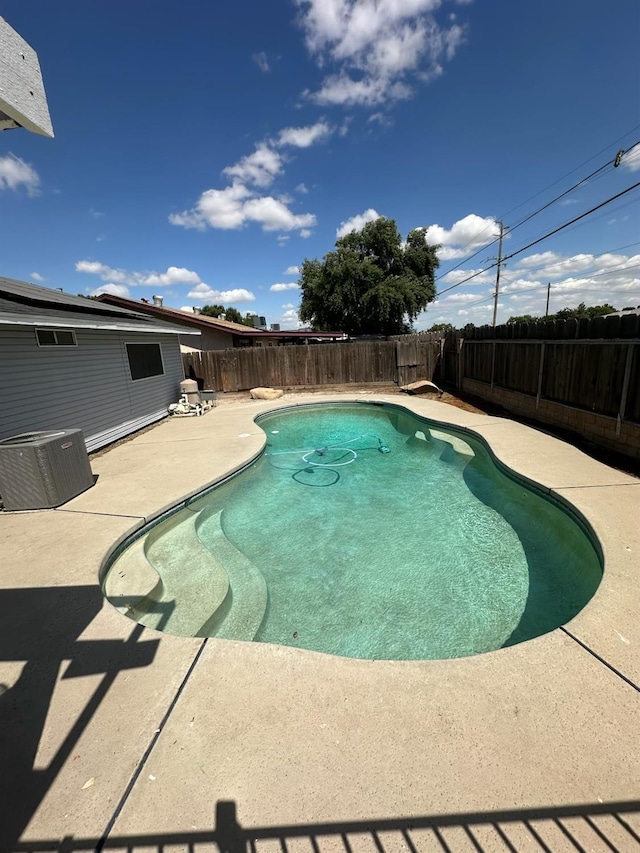 1035 Hoover Way, Hanford, CA 93230 - view of pool with central AC, a patio area, and a fenced backyard