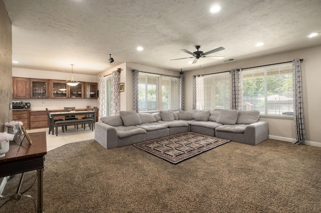 1710 N Filbert Ave, Clovis, CA 93619 - living room featuring healthy amount of natural light, ceiling fan, light carpet, recessed lighting, and baseboards