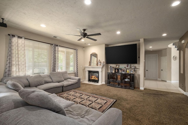 1710 N Filbert Ave, Clovis, CA 93619 - living room with light carpet, baseboards, recessed lighting, a ceiling fan, and a fireplace with flush hearth